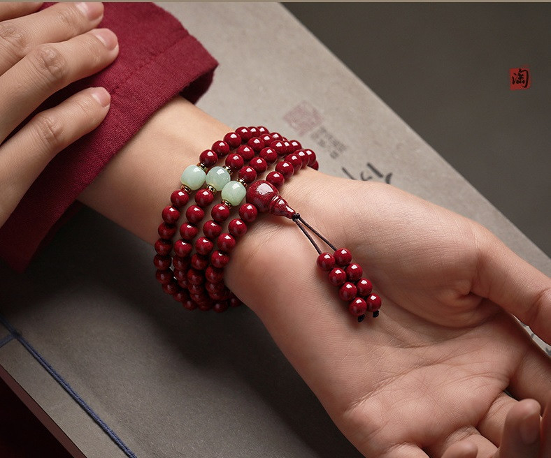 Cinnabar prayer beads worn as necklace full length