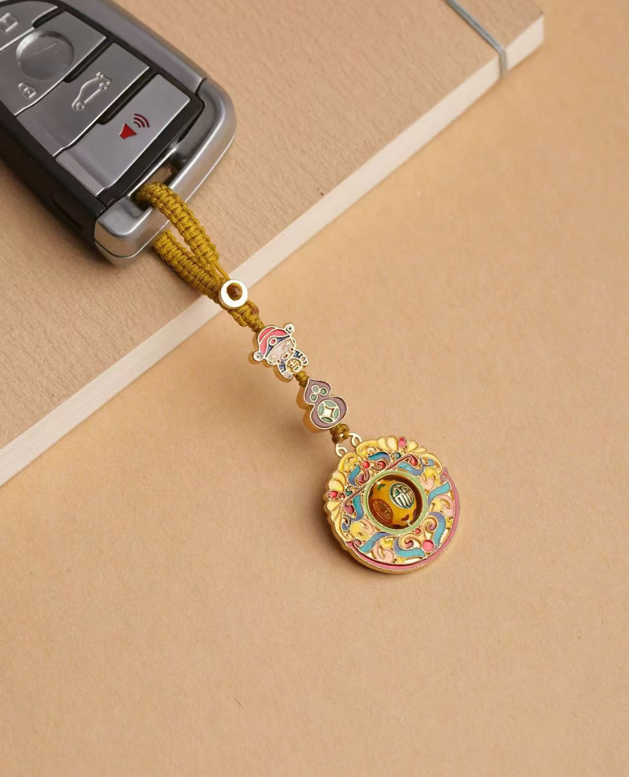 brass wealth god fortune bead keychain