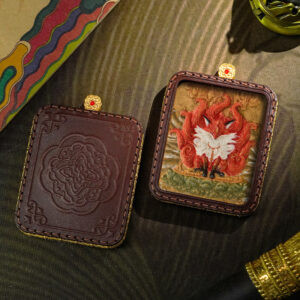 Hand-painted sacred Tsatsa thangka pendant of Red Fox Fairy. Symbol of fortune, romance, and charisma. Tibetan Buddhist spiritual jewelry for good luck.